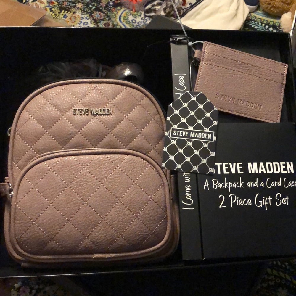 New in box grey purple Steve Madden leather backpack with wallet.